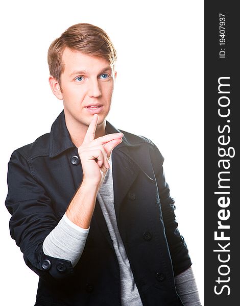 Portrait of gesticulating young man wearing black jacket on isolated white background