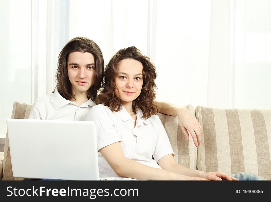 Couple on a couch, browsing