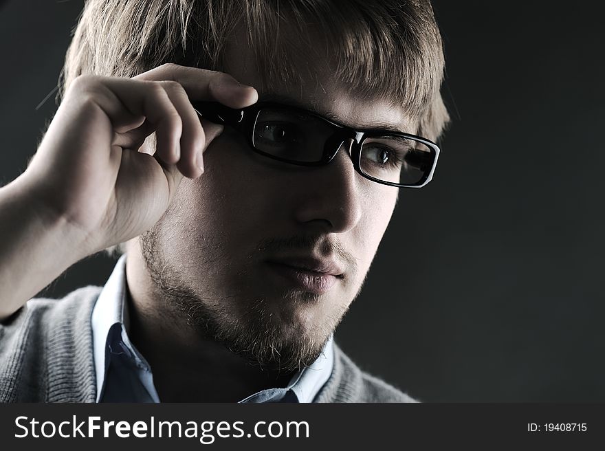 Portrait of a handsome stylish man with glasses