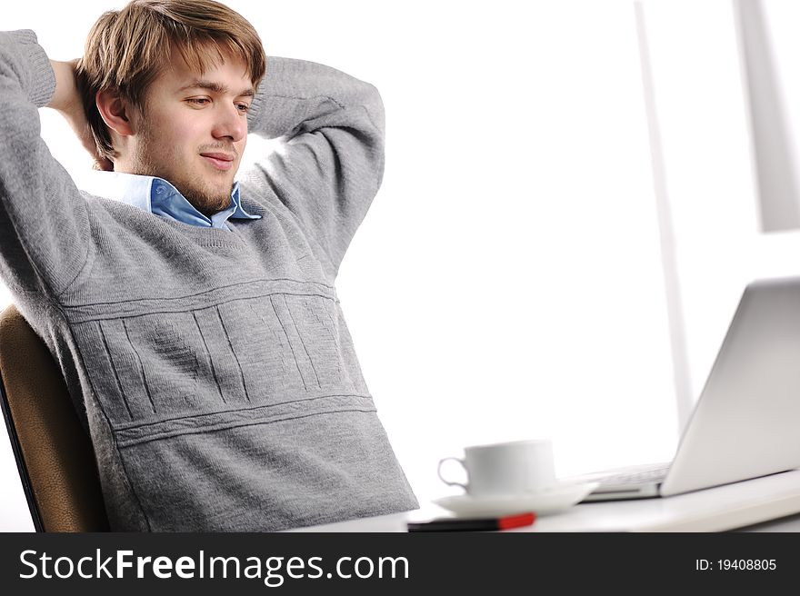 Relaxed young man in office