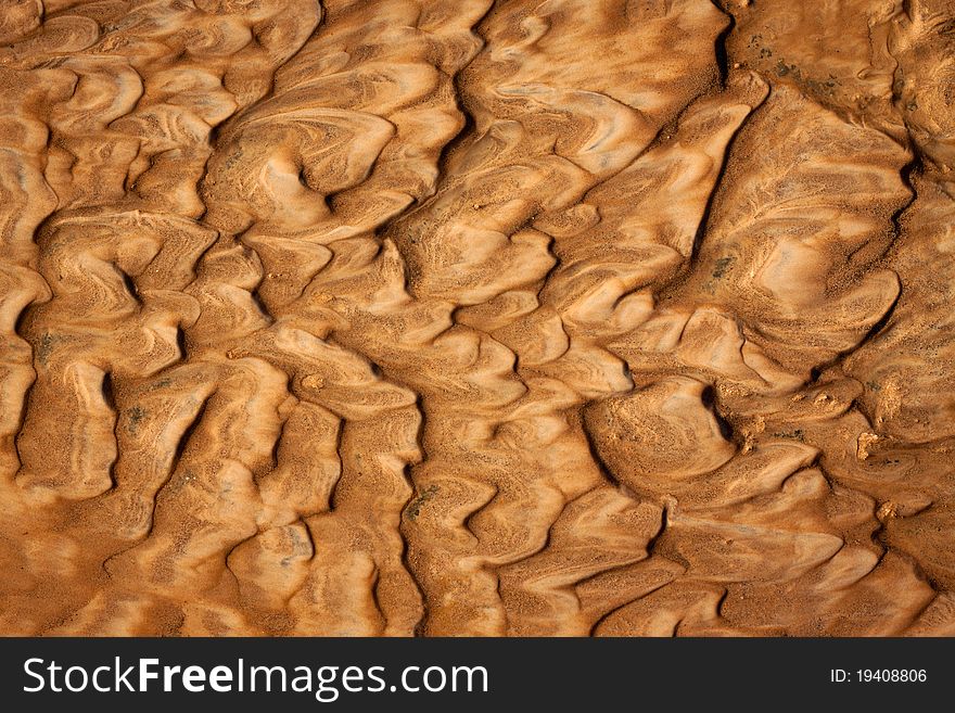 Beautiful rippled wet sand background or texture