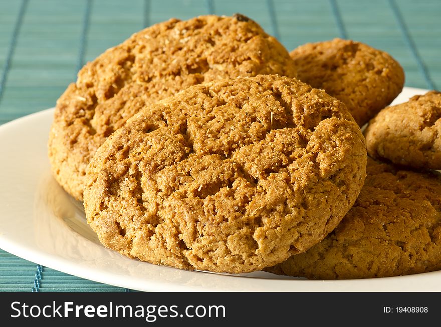 Oatmeal cookies lay on a plate