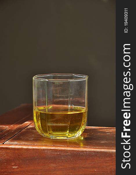 Glass of drinking water for the facilities placed on a wooden table. Glass of drinking water for the facilities placed on a wooden table.