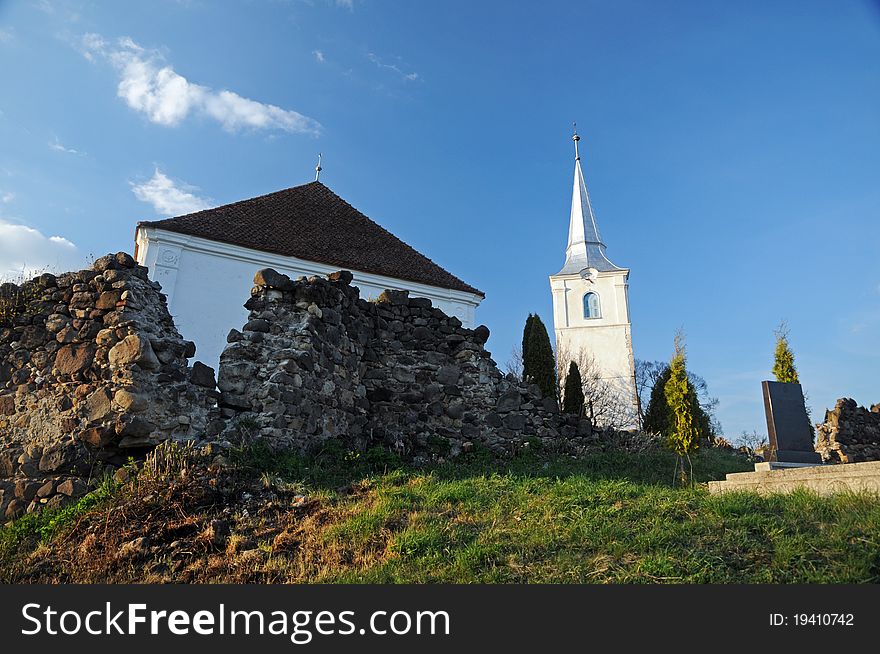 Very old unitarian church surrounded by ancient defence stone walls (XII Century) in Chilieni (Kylen), Covasna county, Transylvania, Romania