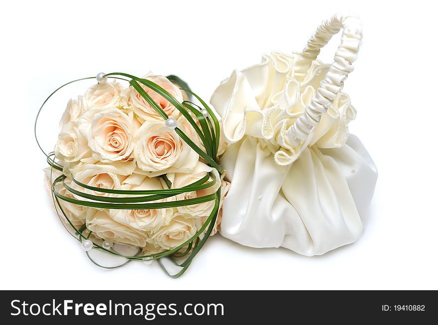 Wedding bag and rose bouquet isolated on white background. Wedding bag and rose bouquet isolated on white background