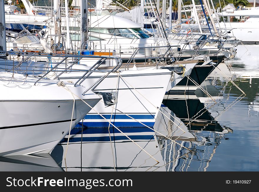 Marina with docked yachts at beautiful sunlight