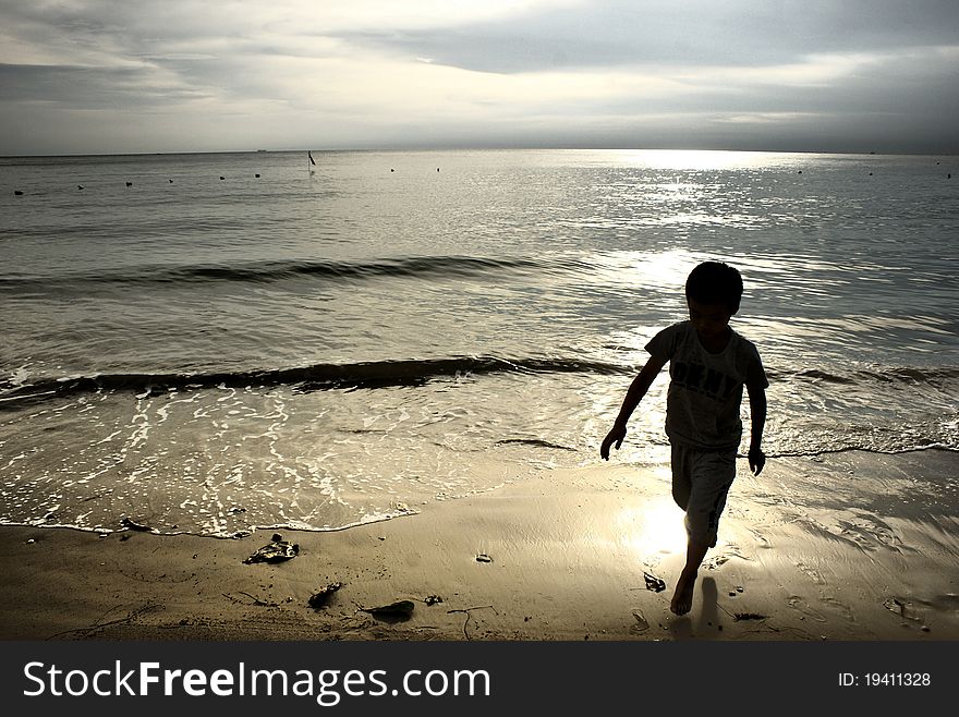 RUNNING BOY ON BEACH