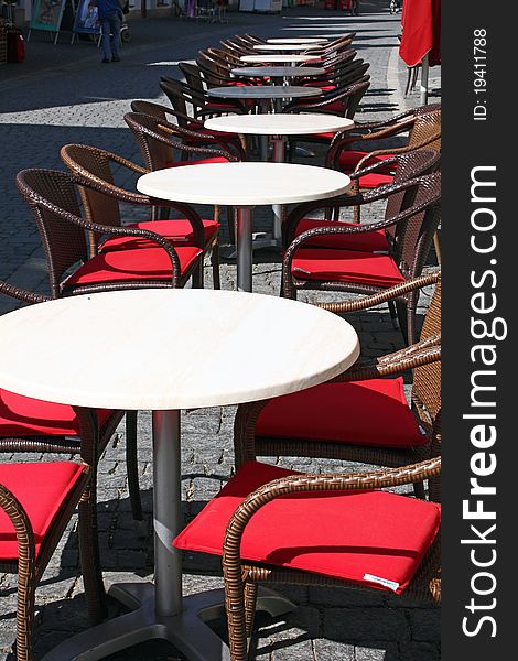 Coffee tables in a pedestrian area in springtime