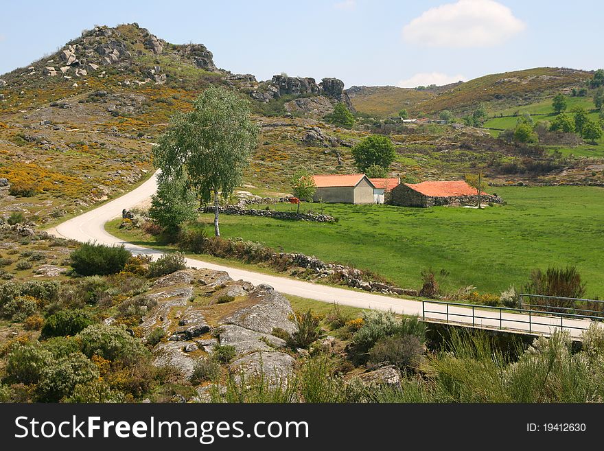 View on houses close to the road in mountains. View on houses close to the road in mountains