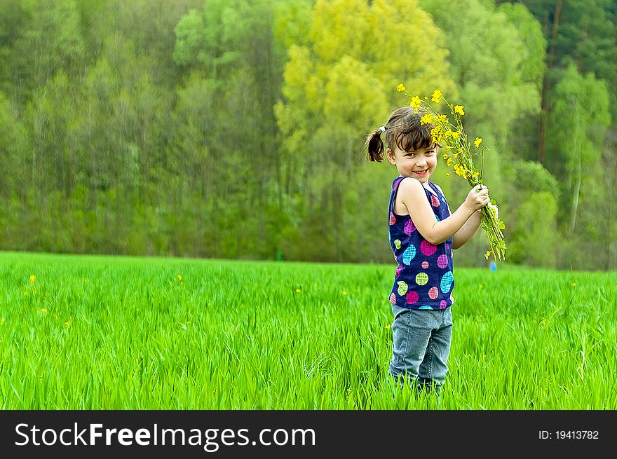 Little girl with flowers outdoors