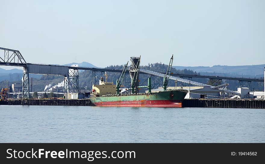 Long Cargo Ship In Longview Washington State.