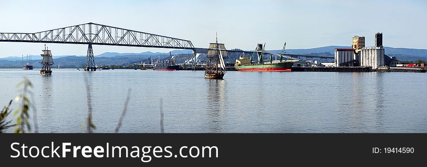 A panorama of the Longview bridge and the surroundings with two galleons reenacting on the Columbia river. A panorama of the Longview bridge and the surroundings with two galleons reenacting on the Columbia river.