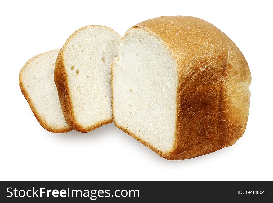 Fresh bread with the cut off slices isolated. Fresh bread with the cut off slices isolated