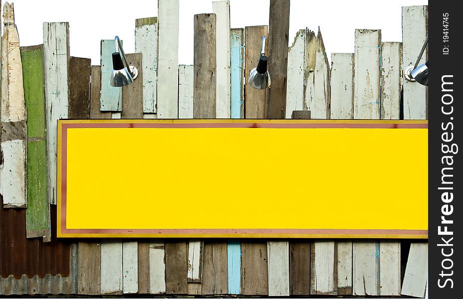 Yellow Signboard On Old Wood Wall With Sport Light