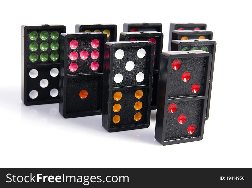 Domino pyramid on white background. Leisure and game concept.