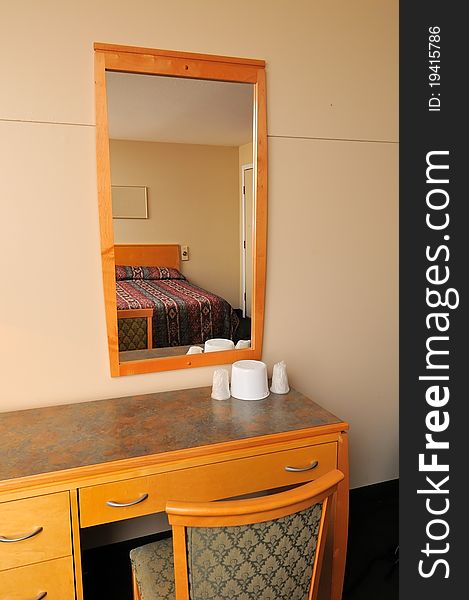 Typical and generic dressing area in bedroom with mirror. Typical and generic dressing area in bedroom with mirror.