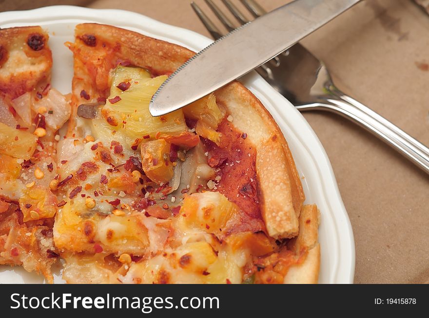 Closeup of freshly baked Italian pizza on white plate. Closeup of freshly baked Italian pizza on white plate.