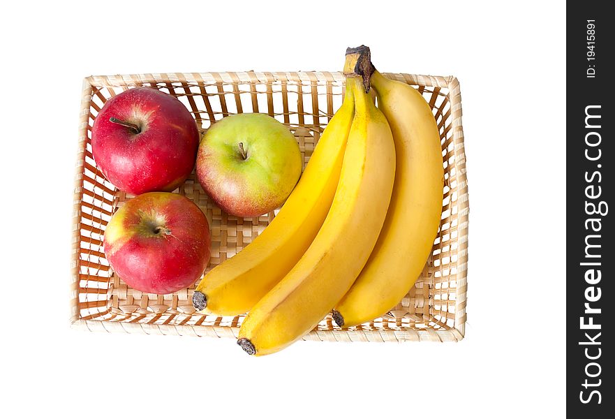 Straw basket of fruit on a white background. Straw basket of fruit on a white background