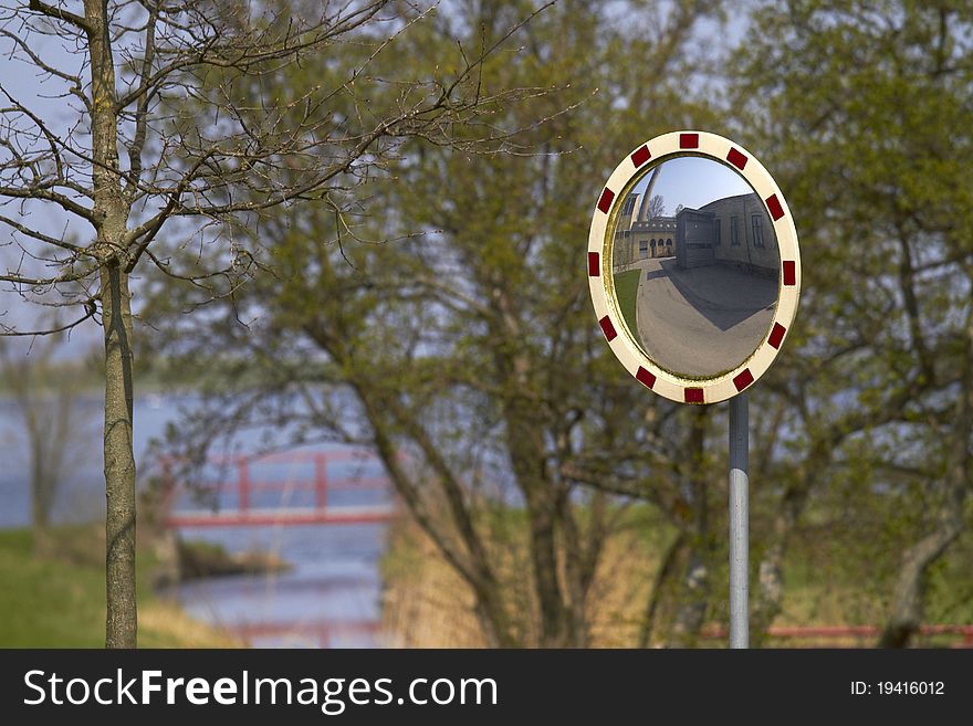 Road traffic mirror sunny tree. Road traffic mirror sunny tree