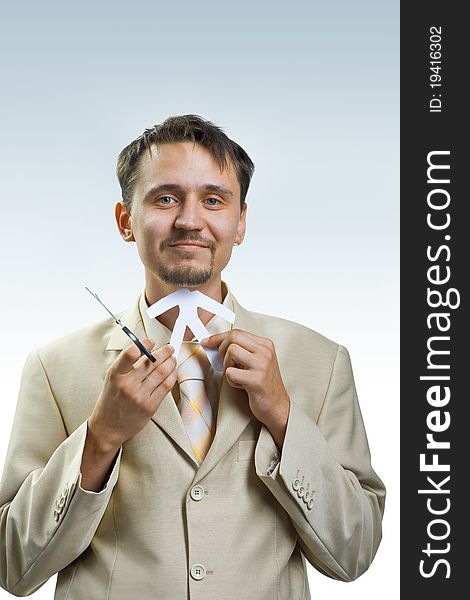 Angry young businessman scissor white paper man. Angry young businessman scissor white paper man