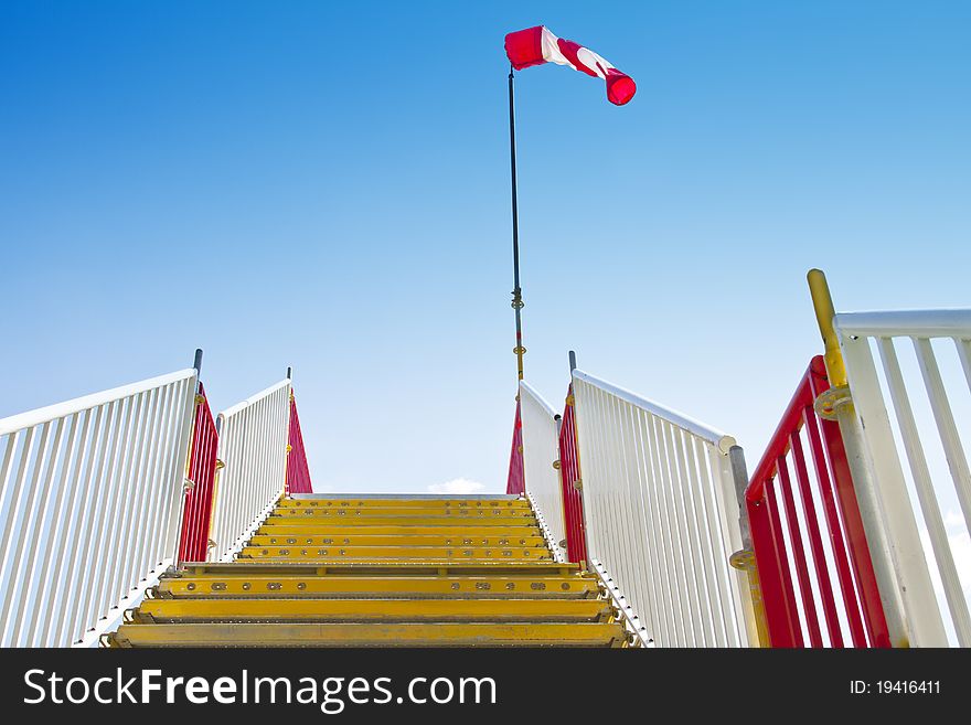 Yellow stairway with inflated windsock on its peak. Yellow stairway with inflated windsock on its peak.