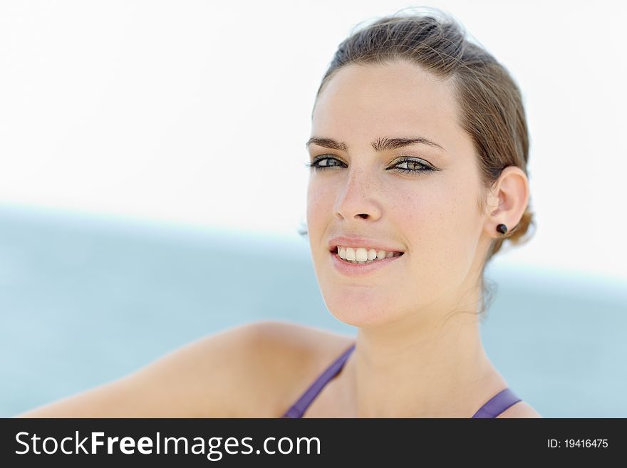 Young beautiful woman smiling at camera