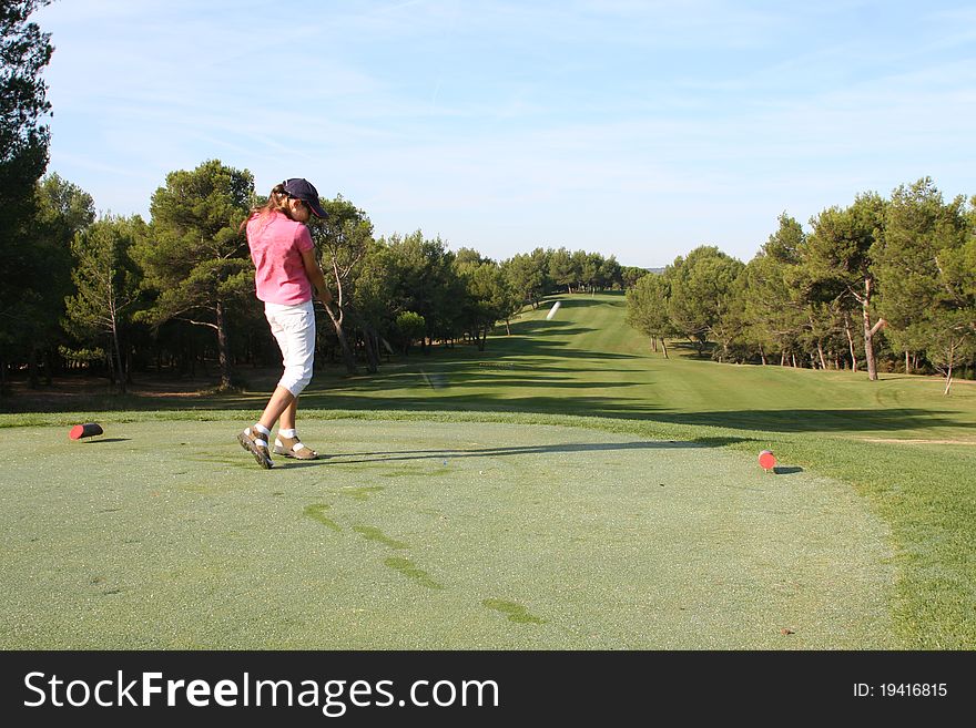 Driving tee shot onto the fairway. Driving tee shot onto the fairway