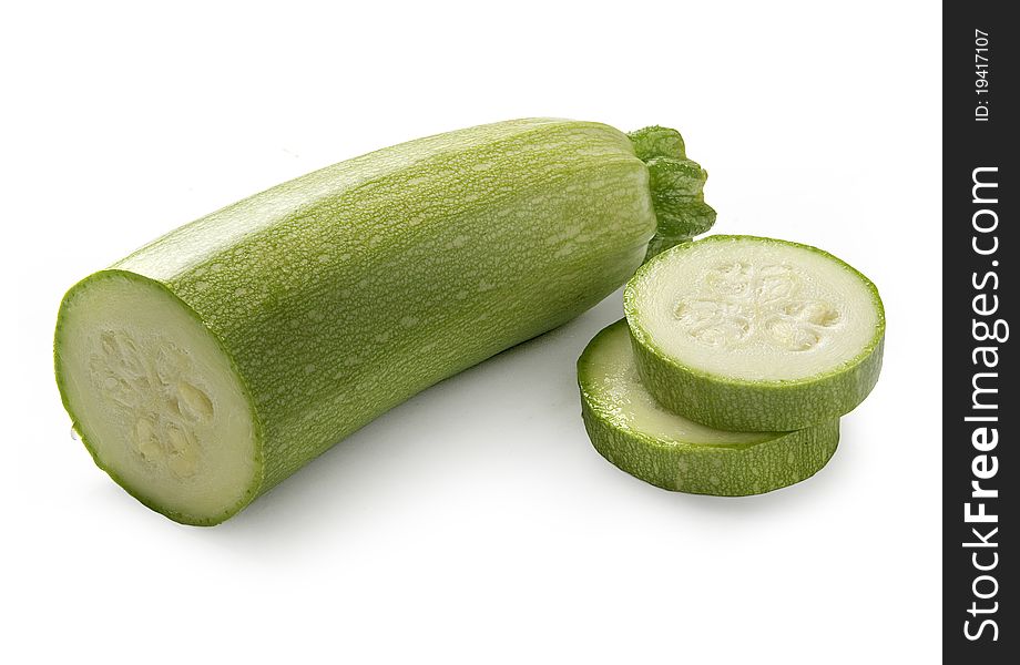 Cut off vegetable marrow on the white background