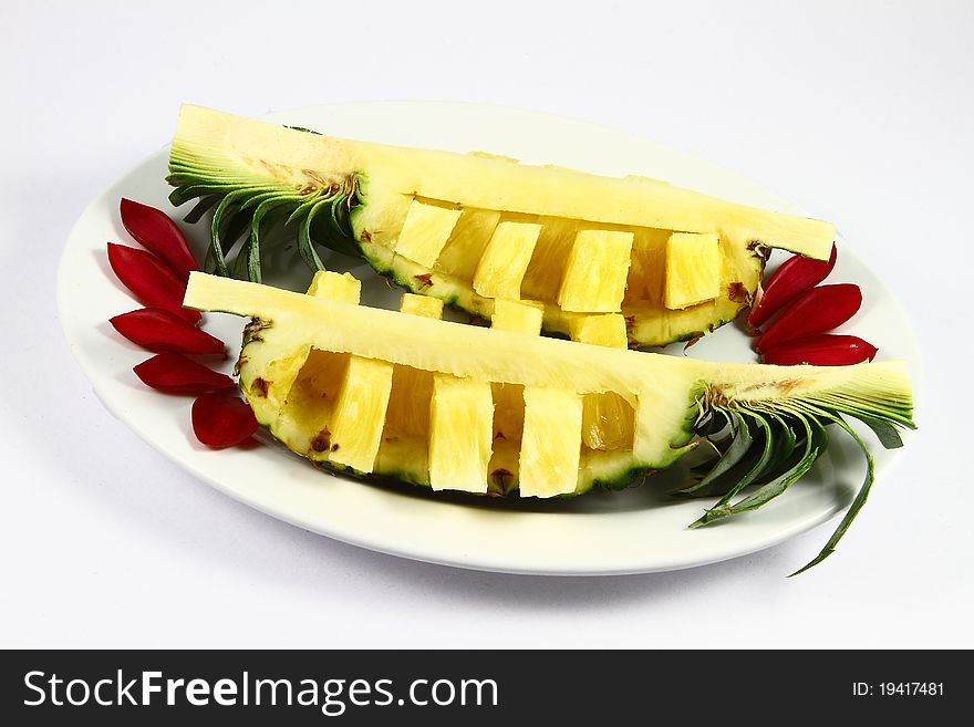 Two pineapple on white plate