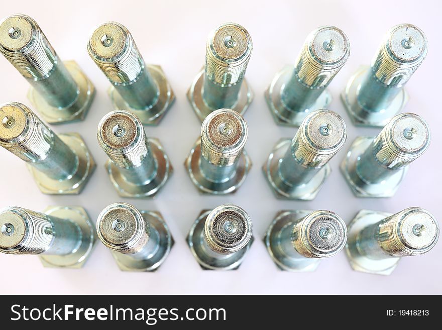 Metal bolts over white and closeup. Metal bolts over white and closeup