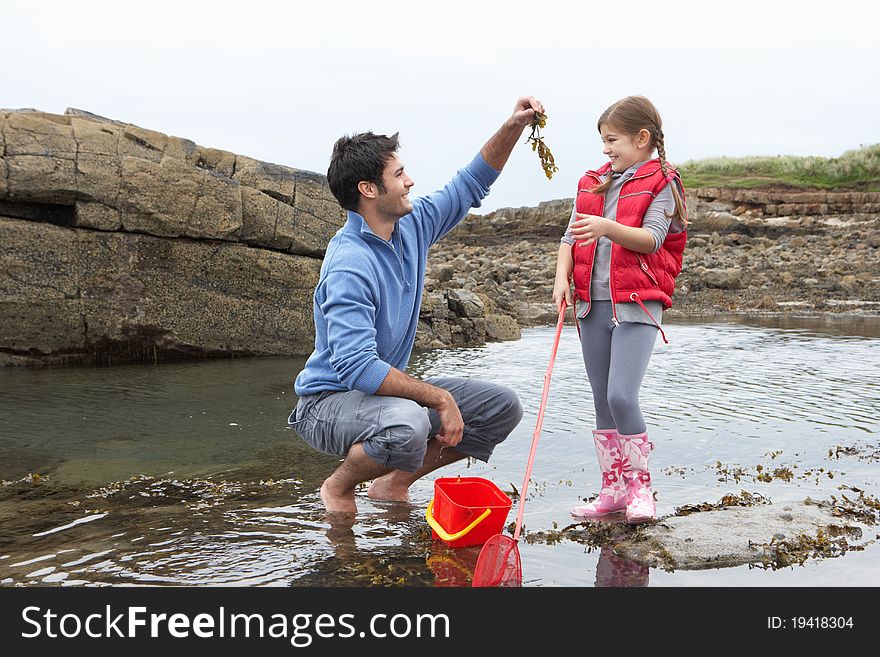 Father With Daughter On Beach