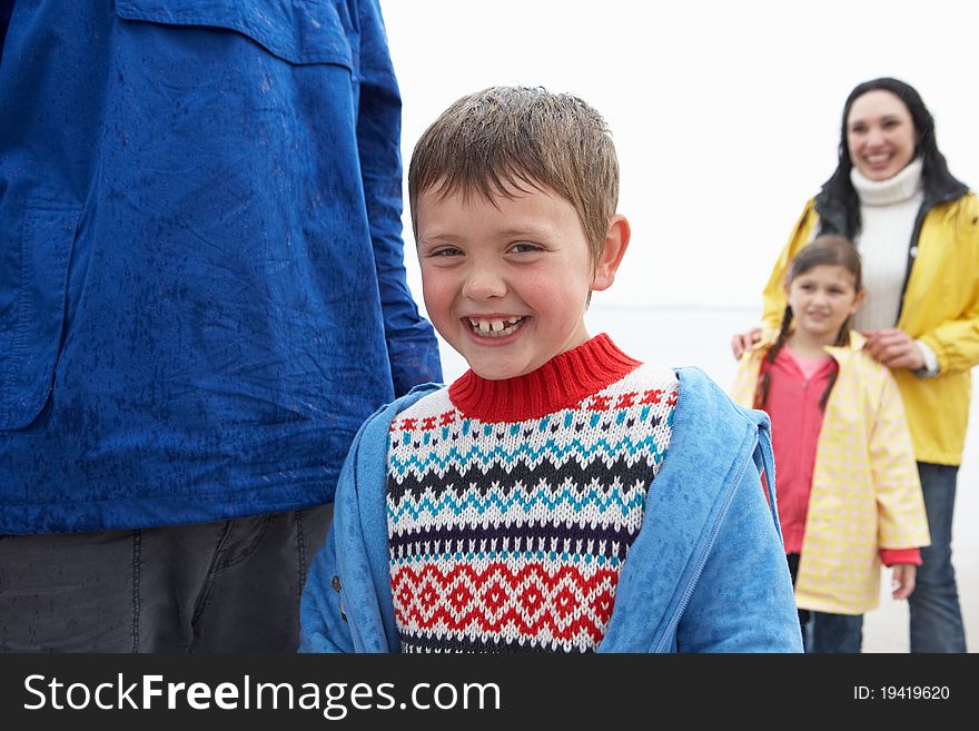 Happy family on beach smiling