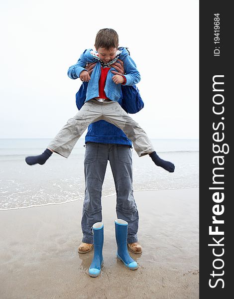 Father and son on beach