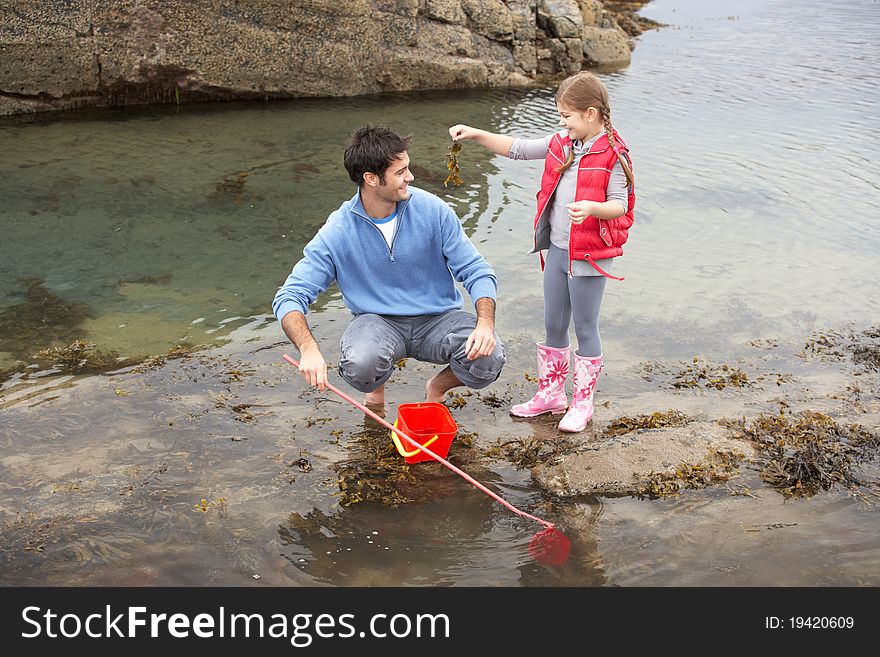 Father with daughter on beach