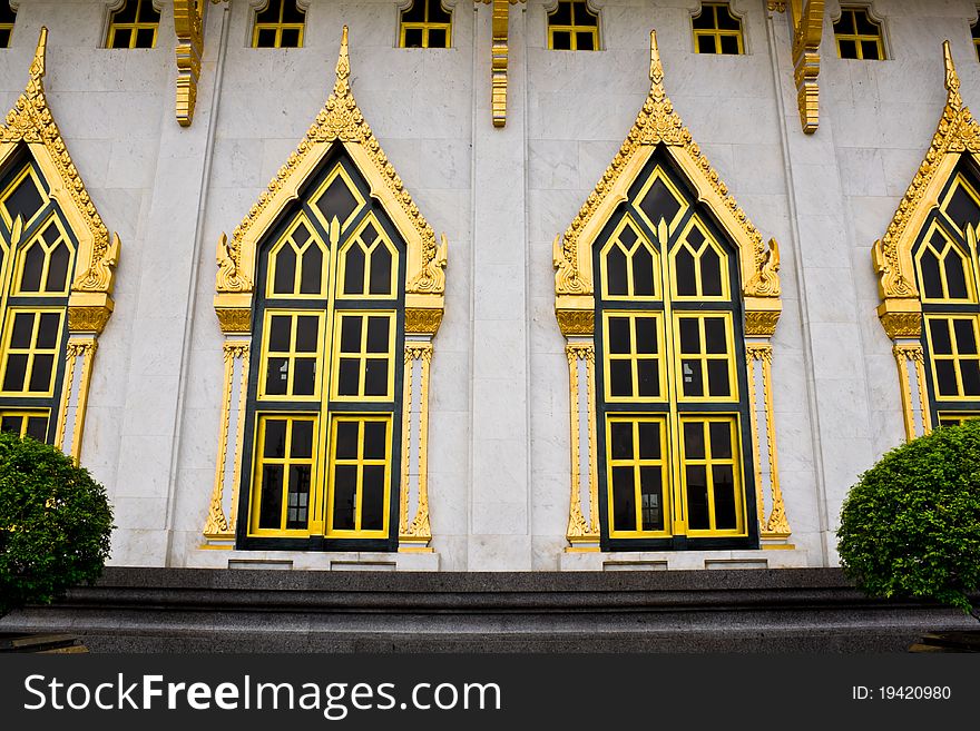 Thai style windows with old temple
