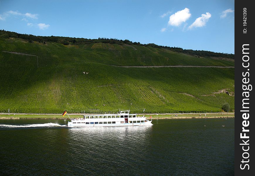 Shadows On Vineyard And Ferry On River Mosel.