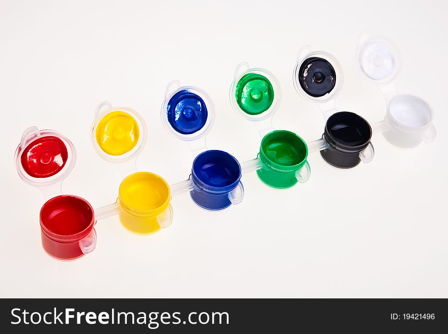 Colorful school water paints isolated over white background. Colorful school water paints isolated over white background.
