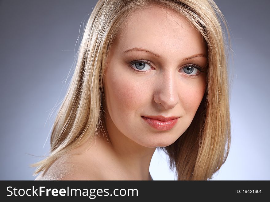 Headshot of beautiful young caucasian teenage girl with bright blue eyes and blonde hair. Headshot of beautiful young caucasian teenage girl with bright blue eyes and blonde hair