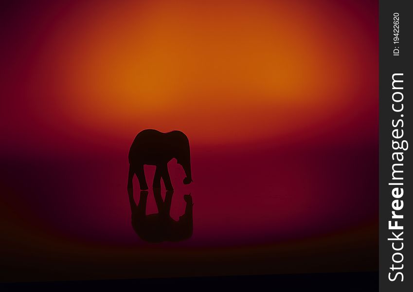 High-contrast elephant sculpture, silhouette.