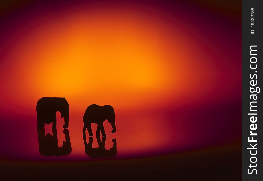 Elephant still-life exhibit. High contrast silhouette of mother and calf. Elephant still-life exhibit. High contrast silhouette of mother and calf.