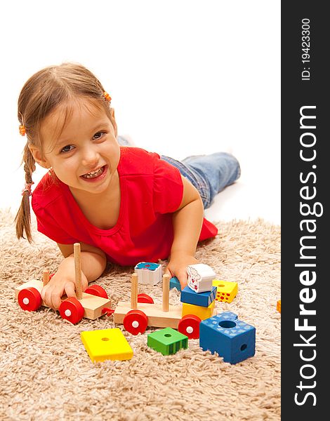 Smile girl playing with wood toys. Smile girl playing with wood toys