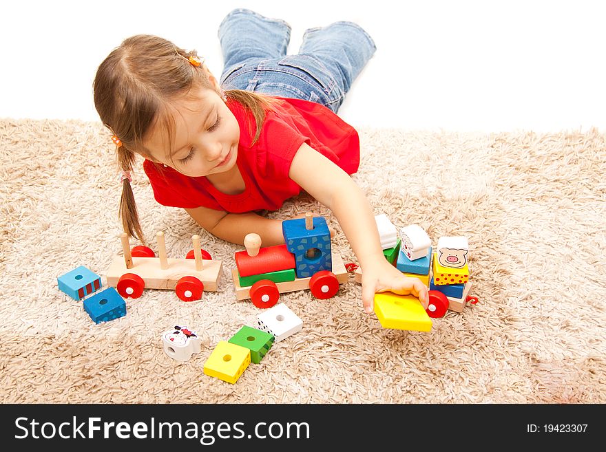 Cute little girl playing on the floor. Cute little girl playing on the floor