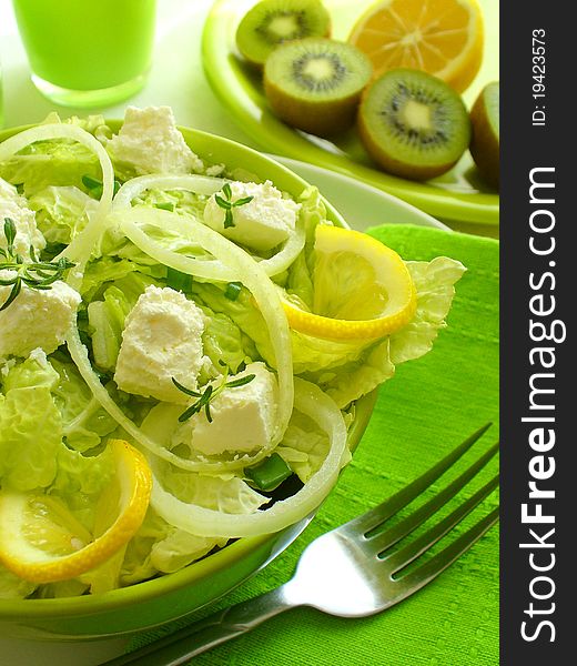 Salad with goat cheese  and fork