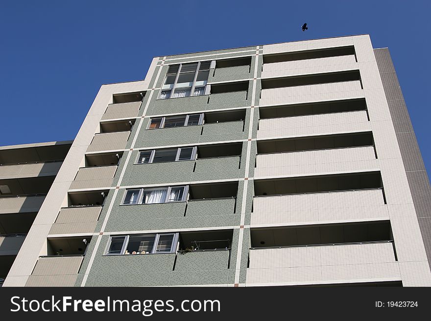 New apartment building under clear blue sky