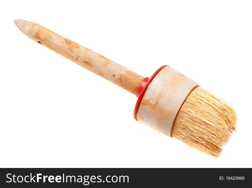 Old paint brush is isolated on a white background