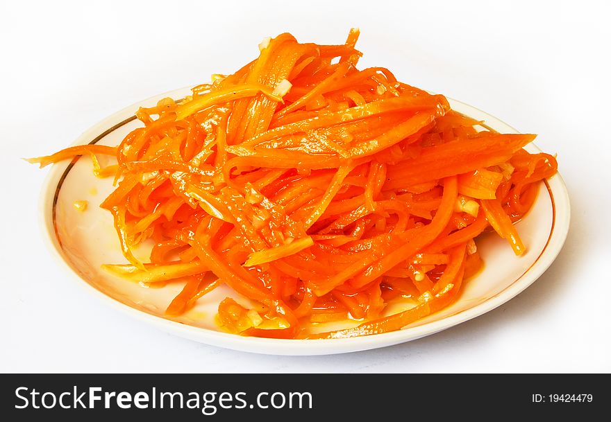 Carrot diet salad on the plate isolated on white background. Carrot diet salad on the plate isolated on white background