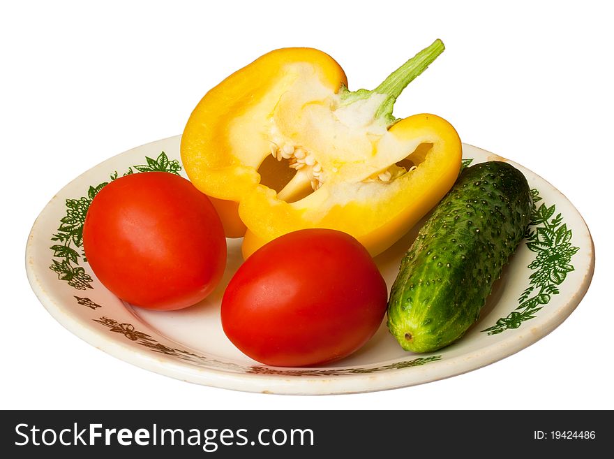 Pepper, tomato and cucumber on the plate