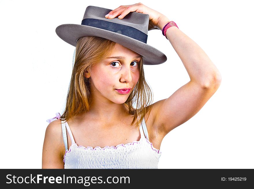 Portrait of cute young teenage girl with hat