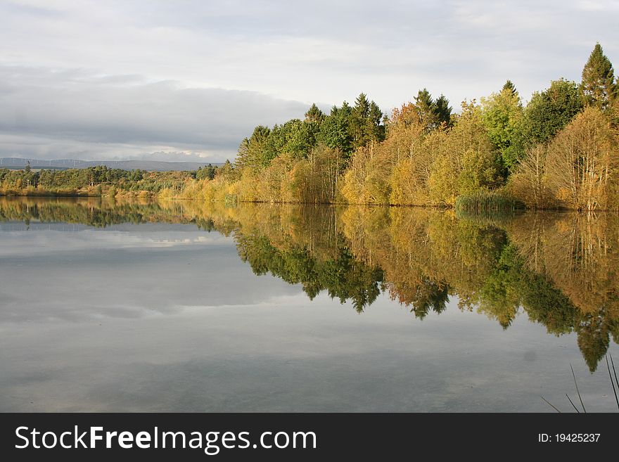 Reflections on a Scottish Lochen (small loch) near Blairdrummond in Stirlingshire. Reflections on a Scottish Lochen (small loch) near Blairdrummond in Stirlingshire