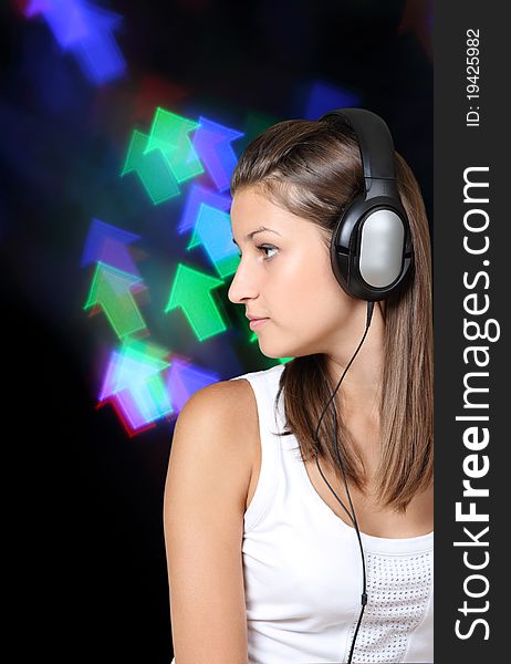 Portrait of the brunette beauty girl wearing headphones. Portrait of the brunette beauty girl wearing headphones